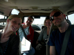 Friends and family in interior of car