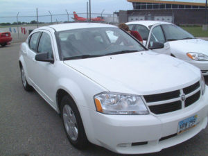 White rental car at parking lot